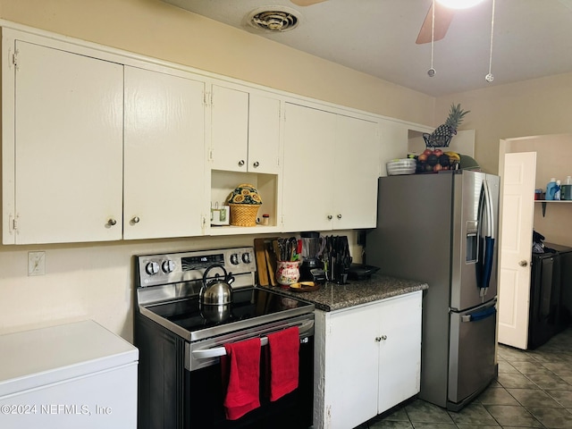 kitchen featuring tile patterned floors, white cabinetry, ceiling fan, and stainless steel appliances