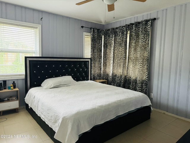 tiled bedroom with ceiling fan