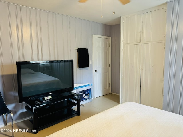 bedroom featuring ceiling fan and light tile patterned floors