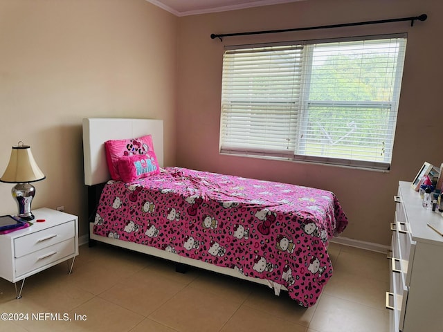 tiled bedroom featuring ornamental molding