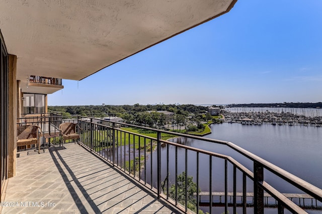 balcony featuring a water view