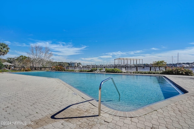 view of swimming pool featuring a patio area