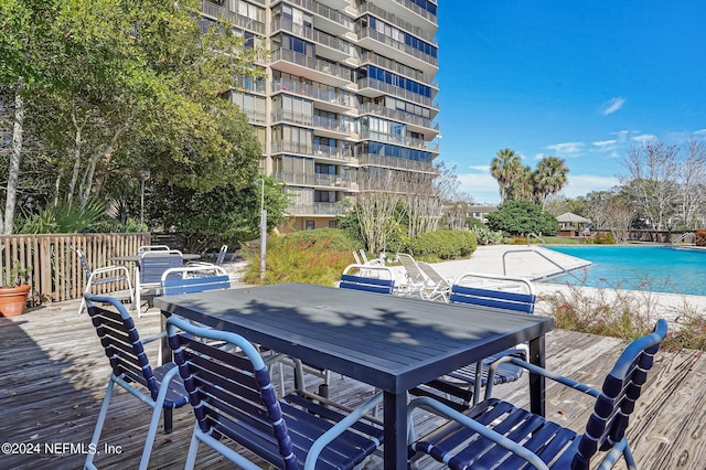 view of swimming pool with a wooden deck