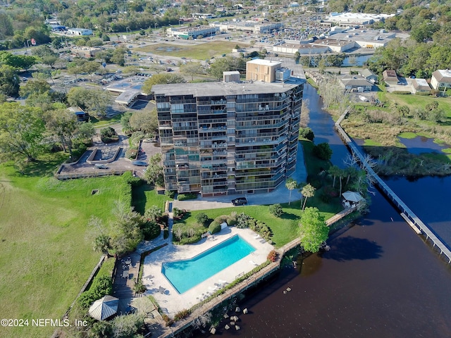 birds eye view of property with a water view