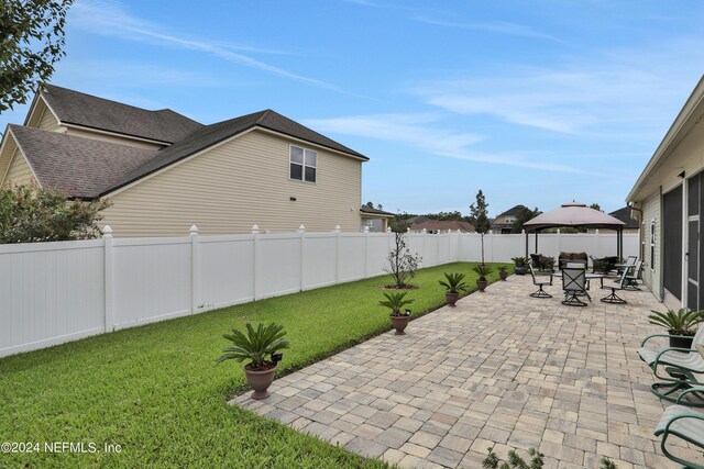 exterior space featuring a gazebo and a patio area