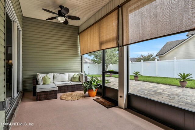 sunroom / solarium with wooden ceiling and ceiling fan