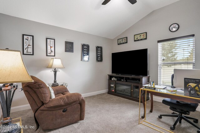 carpeted office space featuring lofted ceiling and ceiling fan