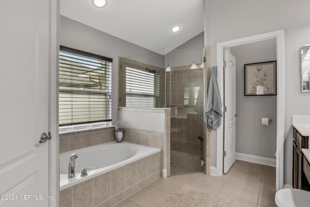 full bathroom featuring vanity, toilet, independent shower and bath, and tile patterned floors