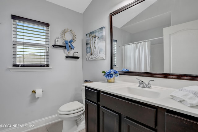 bathroom with vanity, toilet, and tile patterned floors