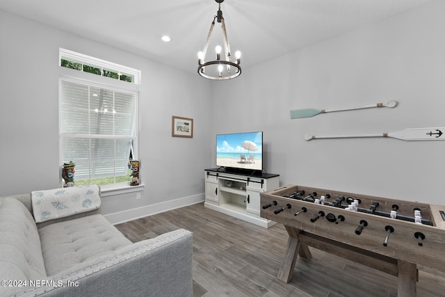 interior space with a chandelier and hardwood / wood-style flooring