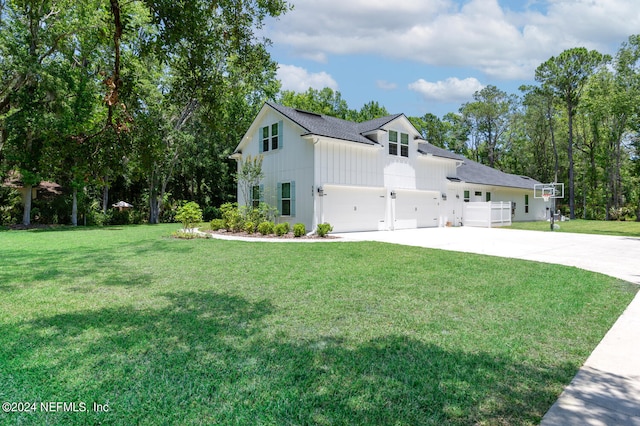 view of side of property with a garage and a yard