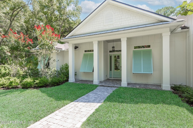 property entrance with a yard