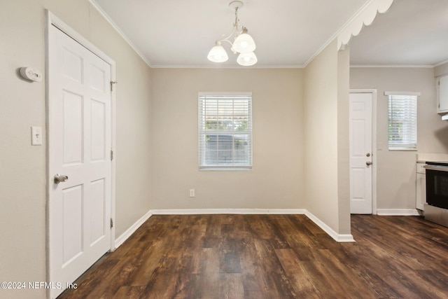 unfurnished dining area featuring ornamental molding, dark hardwood / wood-style floors, and a notable chandelier