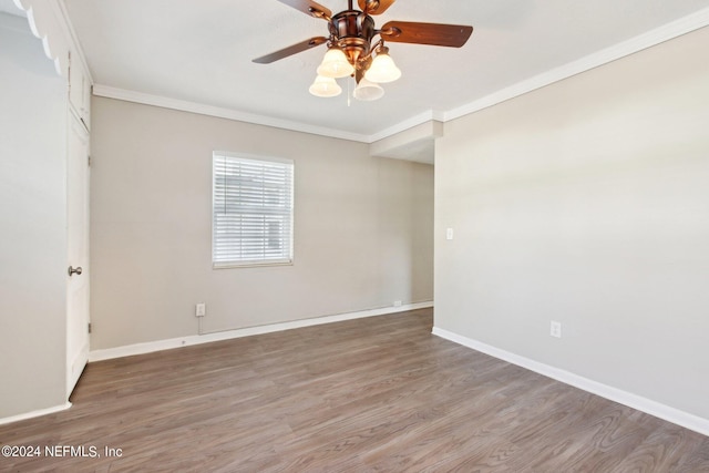 unfurnished room featuring hardwood / wood-style flooring, ceiling fan, and ornamental molding