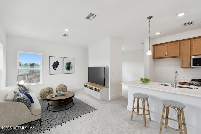 living room with light carpet, baseboards, visible vents, and recessed lighting