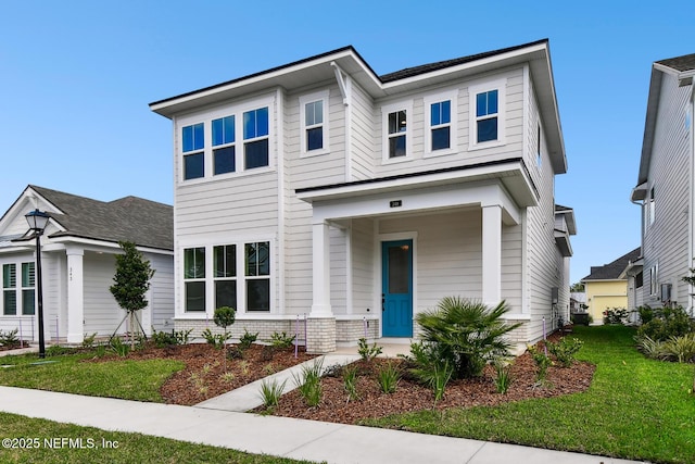 view of front facade featuring brick siding and a front yard