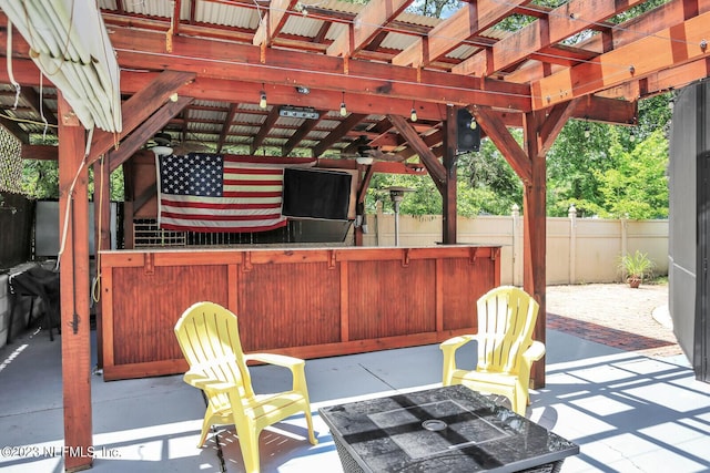 view of patio featuring fence