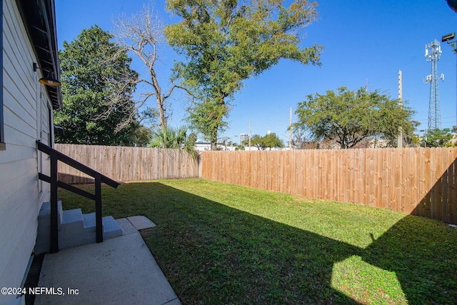 view of yard with a fenced backyard