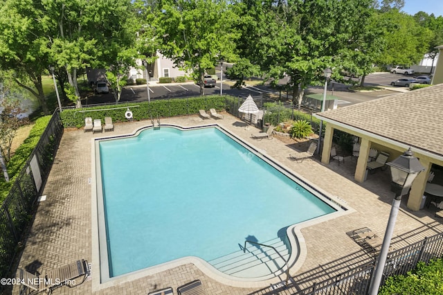 view of swimming pool with a patio