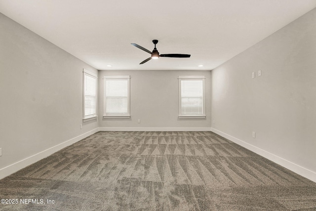 carpeted spare room with ceiling fan and a healthy amount of sunlight