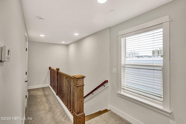 hallway with carpet floors