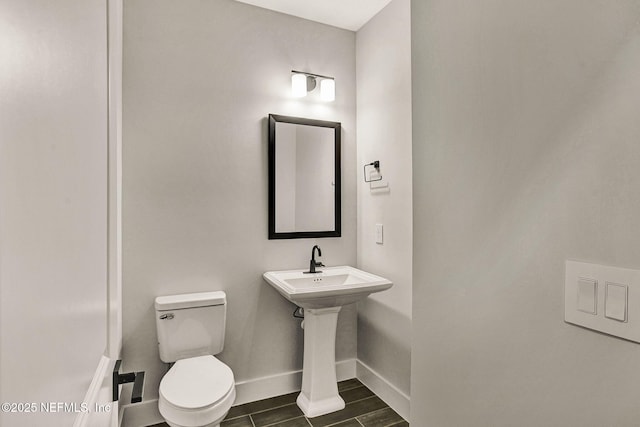 bathroom featuring sink and toilet