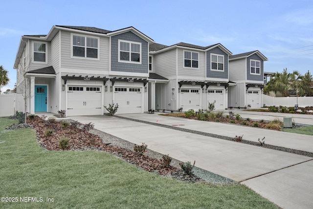 view of front facade with a garage and a front lawn