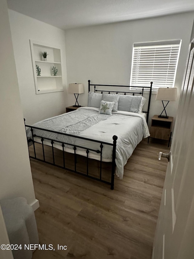 bedroom featuring hardwood / wood-style flooring