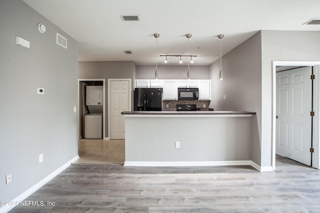 kitchen with backsplash, black appliances, white cabinets, light hardwood / wood-style flooring, and decorative light fixtures