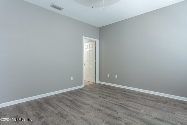 empty room featuring hardwood / wood-style flooring