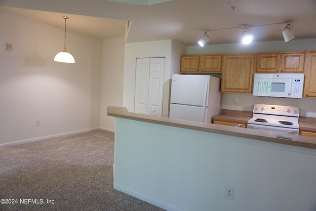 kitchen featuring white appliances, light carpet, hanging light fixtures, and baseboards