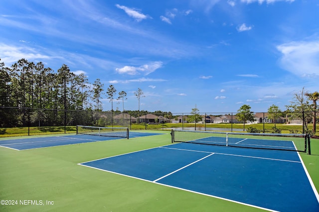 view of sport court with basketball hoop