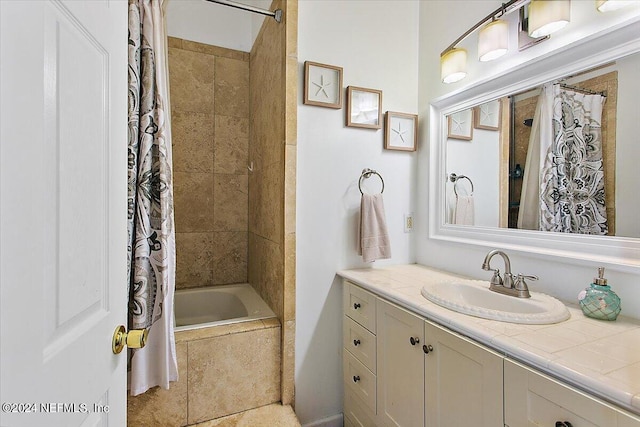 bathroom featuring vanity and shower / tub combo with curtain