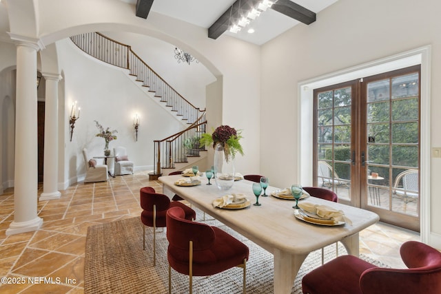 dining space with french doors, decorative columns, and beamed ceiling