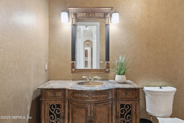 bathroom with vanity and toilet