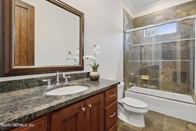 full bath with enclosed tub / shower combo, crown molding, vanity, and toilet