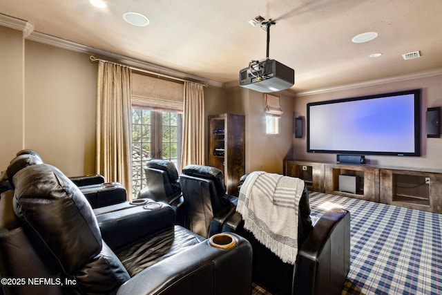 home theater featuring visible vents and crown molding