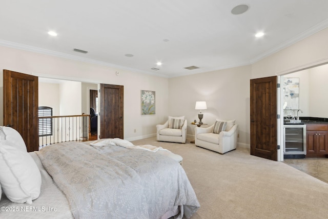 bedroom with light carpet, wine cooler, visible vents, and crown molding