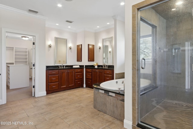 bathroom featuring a stall shower, visible vents, ornamental molding, and vanity