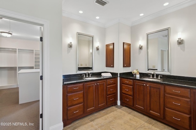 full bath with visible vents, ornamental molding, a spacious closet, vanity, and recessed lighting