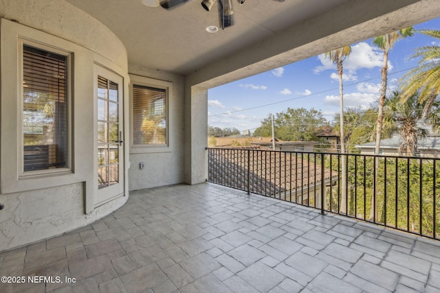 view of patio featuring a balcony