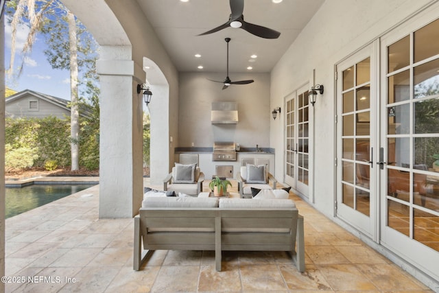 view of patio / terrace featuring french doors, grilling area, an outdoor kitchen, an outdoor pool, and an outdoor living space