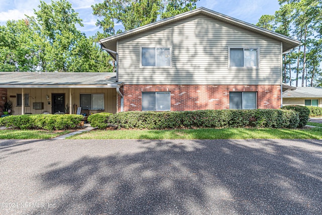 view of front of home featuring brick siding