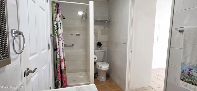 bathroom featuring toilet and walk in shower