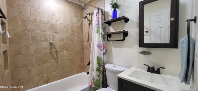 full bathroom featuring shower / bath combo with shower curtain, vanity, and toilet