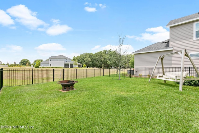 view of yard with an outdoor fire pit