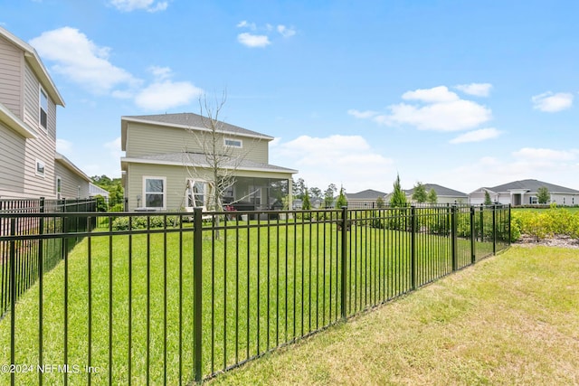 view of yard with a sunroom