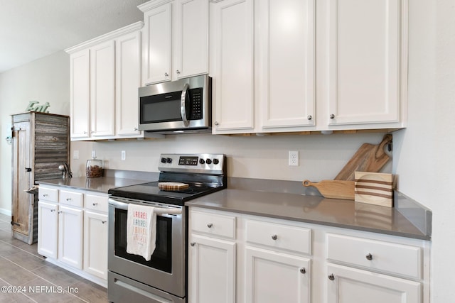 kitchen featuring white cabinets and stainless steel appliances