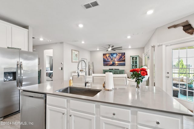 kitchen with white cabinetry, sink, a center island with sink, and appliances with stainless steel finishes