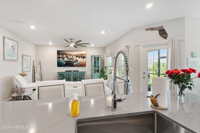 kitchen featuring ceiling fan and sink